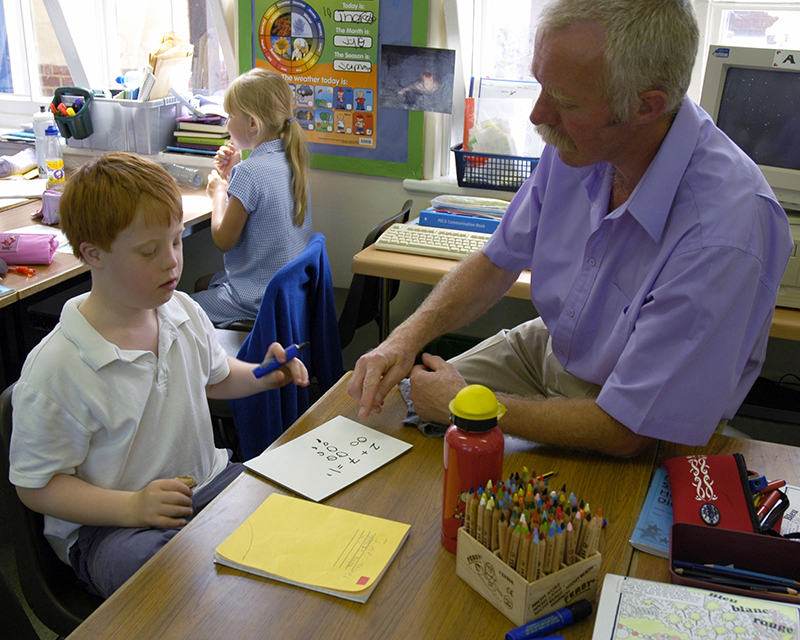 Child with Down syndrome doing number activities
